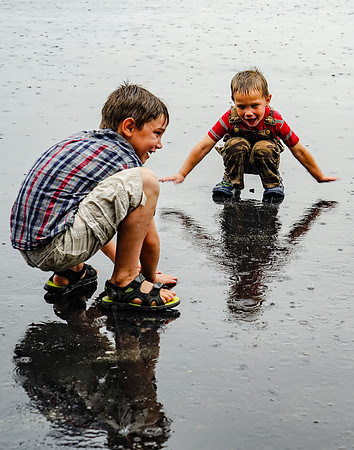 Brothers Playing in the Rain